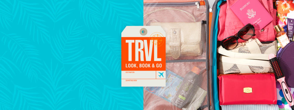 Travel, look and go. Travel essentials packed in luggage.