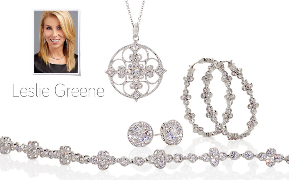 Leslie Greene. Several pieces of silver jewelry decorated with clear gemstones.