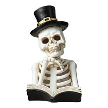 Glitzhome 10.25in. H Halloween Lighted Resin Skull Book Table Decor