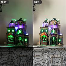 Glitzhome 11"H Lighted Resin Halloween Haunted House Village