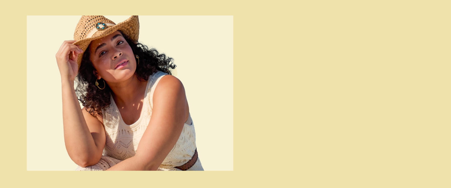 Woman in the sun in a cowboy hat