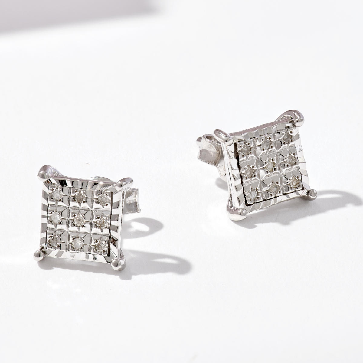 two diamond earrings